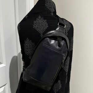 Coach “Manhattan” Sling Pack